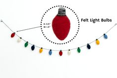 a felt light bulb is hanging on a string with christmas lights attached to the cord