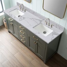 two sinks and mirrors in a bathroom with wood flooring