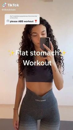 a woman taking a selfie with her cell phone in front of her face and text that reads, flat stomach workout