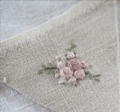 a piece of cloth with pink flowers on it