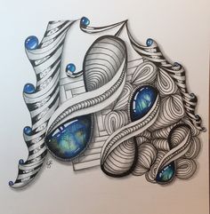 a drawing of an abstract design with blue eyes