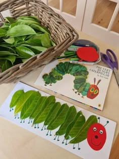 the very hungry caterpillar is next to some cutouts for making it's own book