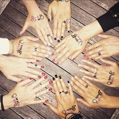 a group of people's hands with nail designs on their fingers in a circle