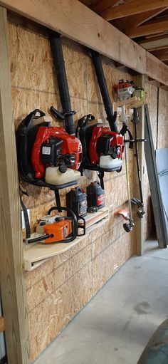 a garage with several tools mounted to the wall