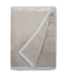 an image of a blanket that is folded on top of each other and has a white border