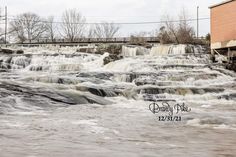 the water is rushing over the rocks and into the river to see what's going on