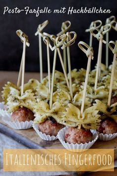 some meatballs with sauce and toothpicks on them