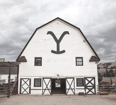 a white barn with the letter y painted on it