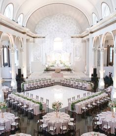 a large banquet hall with tables and chairs