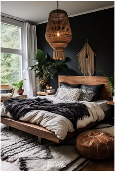 a bedroom with black walls, white and brown bedding and plants in the corner