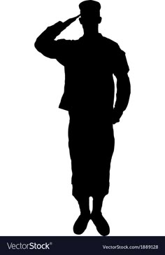 the silhouette of a man in a hat and suit is holding his hand up to his head