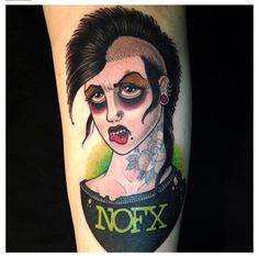 a woman's face with makeup and tattoos on her arm, next to the words xox