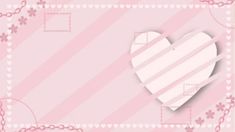 a paper heart on a pink striped background