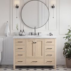 a bathroom with a round mirror above the sink and a potted plant next to it