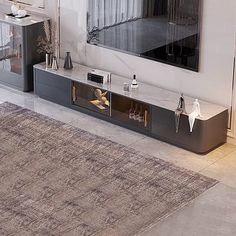 a living room with a large rug and a tv stand in the middle of it