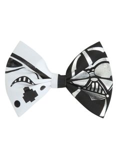 a black and white bow tie with an image of darth vader