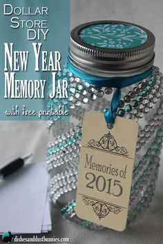 a glass jar with a blue ribbon around it and a tag that says new year memory jar with free printable