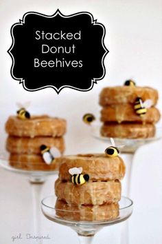 stacked donut beehives on small glass dishes with text overlay that reads stacked donut bees