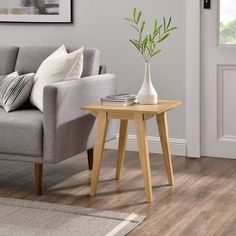 a living room scene with focus on the coffee table and sofa in the foreground