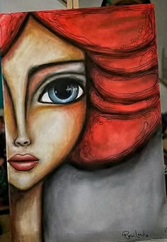 a painting of a woman's face with blue eyes and red hair on a canvas