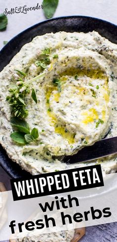 a bowl of whipped feta with fresh herbs on top and the title overlay reads, whipped feta with fresh herbs