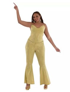 Want to stand out on any dance floor you step foot on?! This classic metallic gold jumpsuit with spaghetti straps is fitted through the chest and thigh and has that iconic flare starting at the knee. It is perfect for school events, fundraisers, disco parties, Halloween and more! Other disco costumes and accessories (footwear, wigs, jewelry) are sold separately on our page – subject to availability. Available in Women's Small/Medium, Large/XL or Plus. Costumes typically run a little smaller than Disco Parties, Disco Halloween, Disco Jumpsuit, Gold Jumpsuit, School Events, Disco Party, Dance Floor, Adult Costumes, Metallic Gold