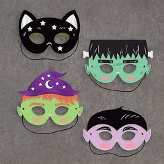 four masks with different designs and colors on them