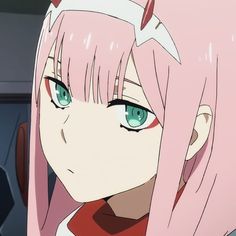 an anime character with pink hair and blue eyes