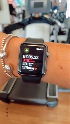 an apple watch on someone's arm showing the time