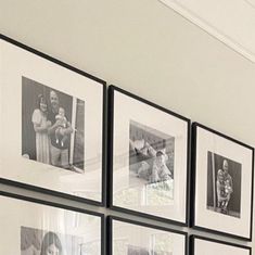 black and white photos hanging on the wall