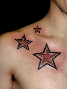 a man with three stars on his chest and one has a star tattoo on it