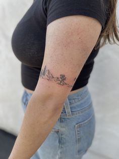 a woman with a tattoo on her arm