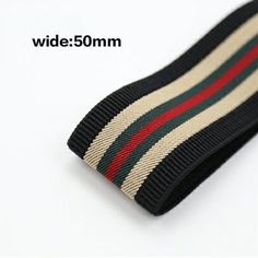 a pair of black socks with red, white and green stripes