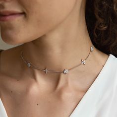 A nature-inspired dainty choker decorated with a mixture of floret and round shaped pavé crystals. Colors in: Sterling Silver / Gold Vermeil Cubic Zirconia pave crystals Hypoallergenic, lead, and nickel free Chain Length: 12+3in extension (30.4+7.6cm) Crystal Diameter: 0.4in (1cm) Handcrafted in NYC #N058 2-3 Business Days Dainty Choker, Layering Necklaces, Silver Choker Necklace, Silver Choker, Crystal Choker, Jewelry Inspo, Chain Lengths, Layered Necklaces, Nature Inspired