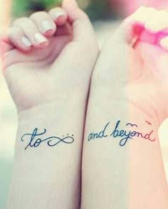 two people with tattoos on their arms and the words tattoo written in cursive writing