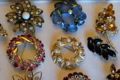 there are many different brooches in the box