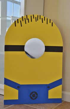 a cardboard cut out of a yellow and blue minion