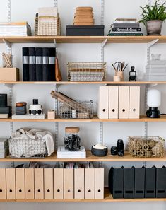 the shelves are filled with books and office supplies