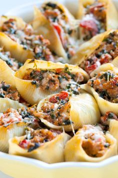 a casserole dish filled with pasta and meat