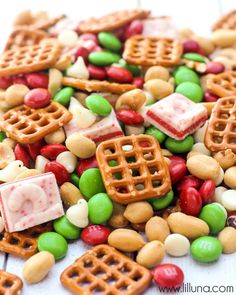 christmas snack mix with pretzels, candy and marshmallows on top