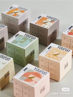 many different colored boxes are stacked on top of each other with the words yoyo written in them