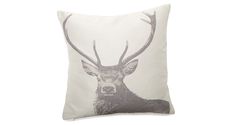 a white pillow with an image of a deer on it's face and antlers