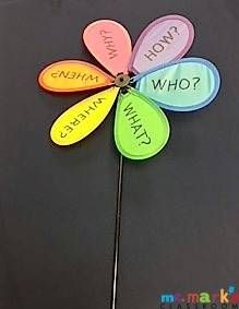 a flower shaped pinwheel with words written on it