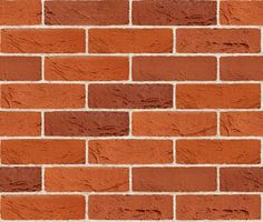 an orange brick wall that is very close up