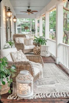 a porch with wicker furniture and plants