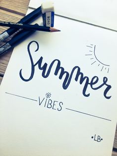 a piece of paper with the word summer written on it next to two pencils