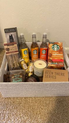 the starbucks coffee gift box is packed with drinks and snacks