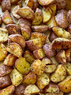 cooked potatoes with herbs and seasoning in a pan