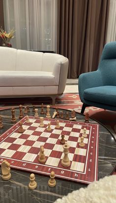 a living room filled with furniture and a chess board