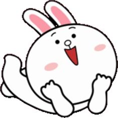 a white rabbit with pink ears sitting on the ground and sticking its tongue out to the side